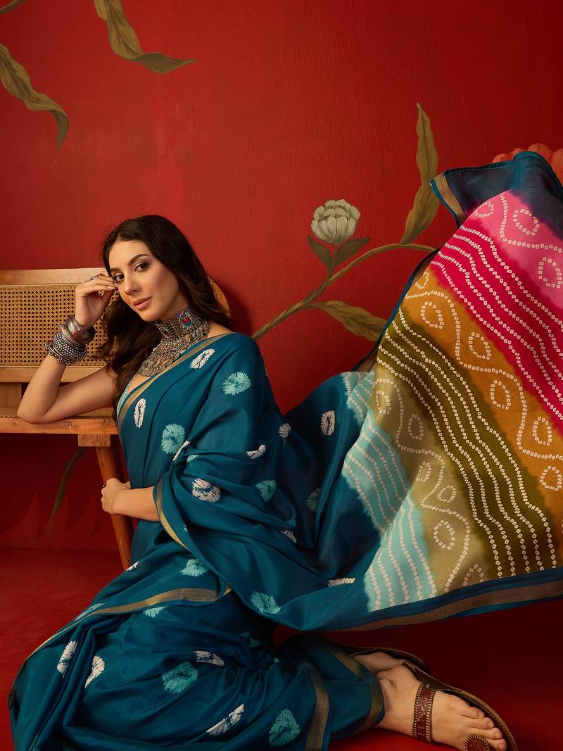 Teal silk cotton bandhni printed saree with unstitched blouse piece.