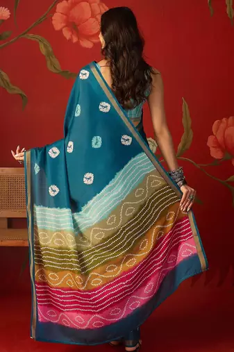 Teal silk cotton bandhni printed saree with unstitched blouse piece.