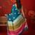 Teal silk cotton bandhni printed saree with unstitched blouse piece.