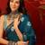 Teal silk cotton bandhni printed saree with unstitched blouse piece.