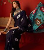 Navy silk cotton bandhni printed saree with unstitched blouse piece.