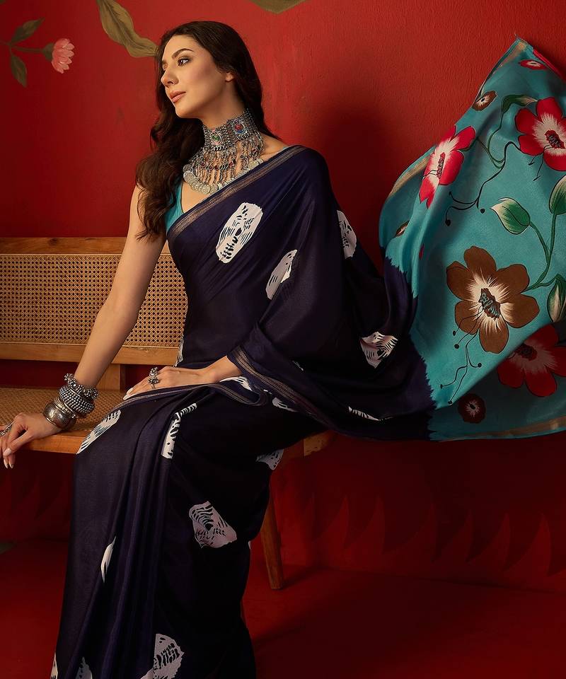 Navy silk cotton bandhni printed saree with unstitched blouse piece.