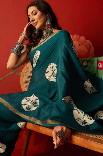 Rama silk cotton bandhni printed saree with unstitched blouse piece.