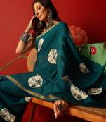 Rama silk cotton bandhni printed saree with unstitched blouse piece.