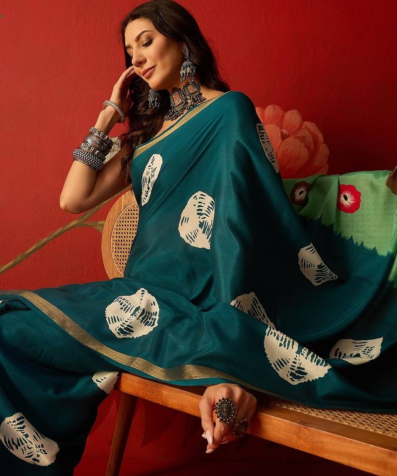 Rama silk cotton bandhni printed saree with unstitched blouse piece.