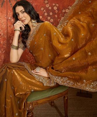 Gold tissue satin embroidered saree with unstitched blouse piece. 1