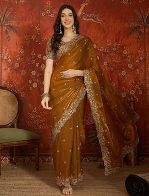 Gold tissue satin embroidered saree with unstitched blouse piece. 3
