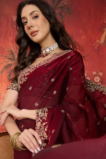 Maroon tissue satin embroidered saree with unstitched blouse piece.