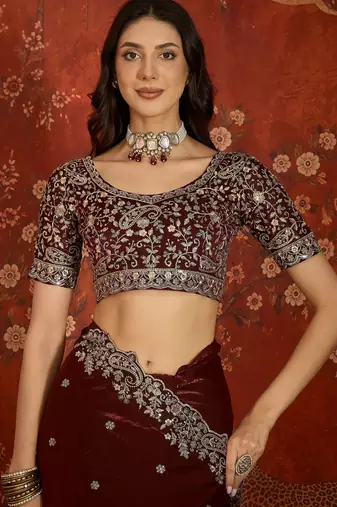 Maroon tissue satin embroidered saree with unstitched blouse piece.