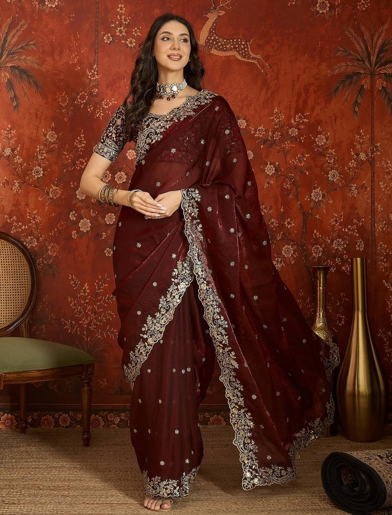 Maroon tissue satin embroidered saree with unstitched blouse piece.
