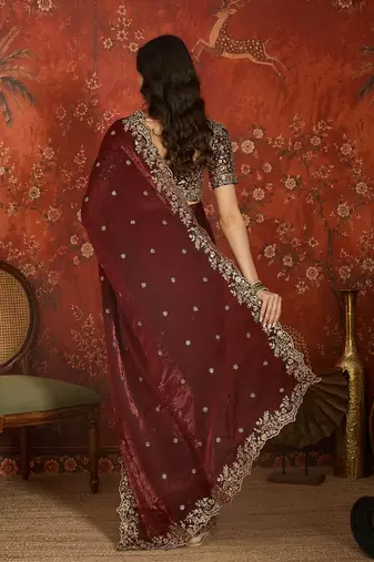 Maroon tissue satin embroidered saree with unstitched blouse piece.