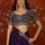 Purple tissue satin embroidered saree with unstitched blouse piece.