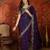 Purple tissue satin embroidered saree with unstitched blouse piece.