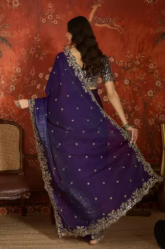 Purple tissue satin embroidered saree with unstitched blouse piece.
