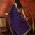 Purple tissue satin embroidered saree with unstitched blouse piece.