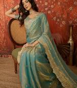 Sky blue tissue satin embroidered saree with unstitched blouse piece.