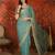 Sky blue tissue satin embroidered saree with unstitched blouse piece.