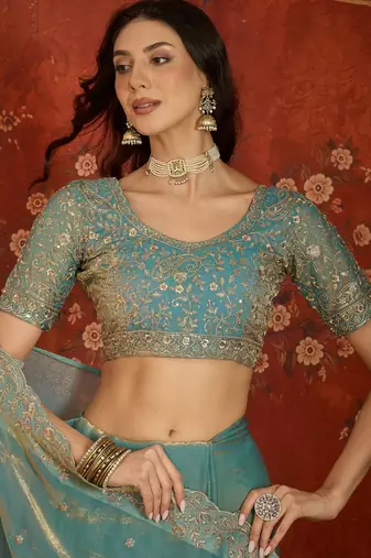 Sky blue tissue satin embroidered saree with unstitched blouse piece.