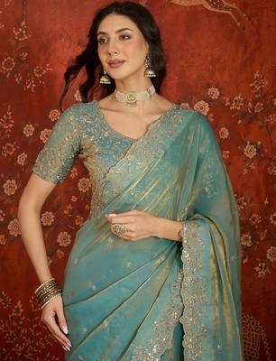 Sky blue tissue satin embroidered saree with unstitched blouse piece. 5