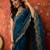Teal tissue satin embroidered saree with unstitched blouse piece.