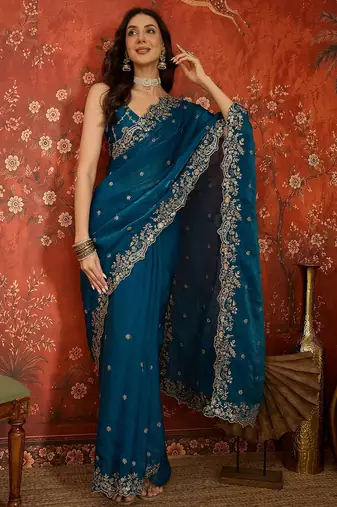 Teal tissue satin embroidered saree with unstitched blouse piece.