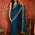 Teal tissue satin embroidered saree with unstitched blouse piece.
