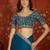 Teal tissue satin embroidered saree with unstitched blouse piece.
