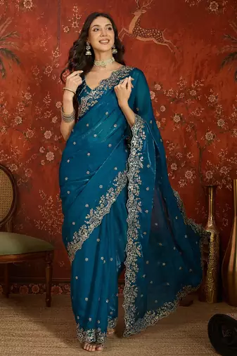 Teal tissue satin embroidered saree with unstitched blouse piece.
