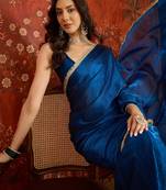 Teal tissue satin sequins saree with unstitched blouse piece.