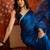 Teal tissue satin sequins saree with unstitched blouse piece.