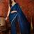 Teal tissue satin sequins saree with unstitched blouse piece.