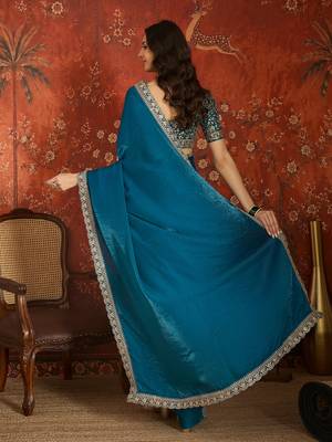 Teal tissue satin embroidered saree with unstitched blouse piece. 4