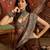 Brown silk blend crepe printed saree with unstitched blouse piece.