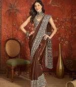 Brown silk blend crepe printed saree with unstitched blouse piece.