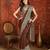 Brown silk blend crepe printed saree with unstitched blouse piece.