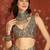 Brown silk blend crepe printed saree with unstitched blouse piece.