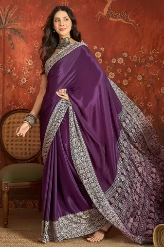 Purple silk blend crepe printed saree with unstitched blouse piece.
