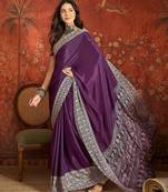 Purple silk blend crepe printed saree with unstitched blouse piece.