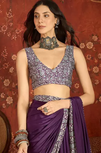 Purple silk blend crepe printed saree with unstitched blouse piece.