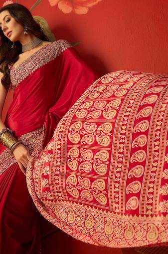 Red silk blend crepe printed saree with unstitched blouse piece.