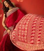 Red silk blend crepe printed saree with unstitched blouse piece.