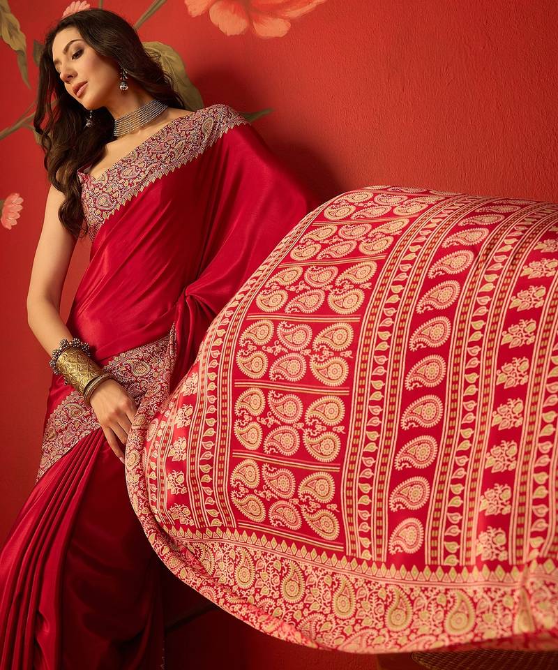 Red silk blend crepe printed saree with unstitched blouse piece.
