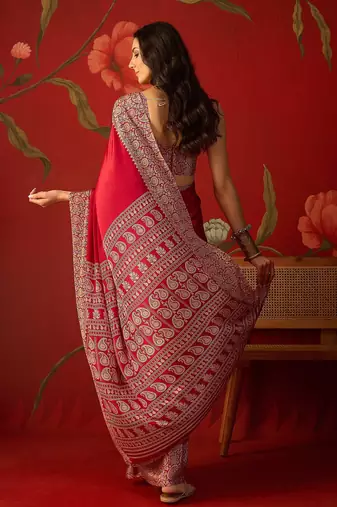 Red silk blend crepe printed saree with unstitched blouse piece.