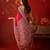 Red silk blend crepe printed saree with unstitched blouse piece.