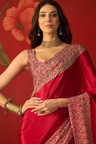 Red silk blend crepe printed saree with unstitched blouse piece.