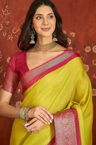 Yellow silk cotton zari saree with unstitched blouse piece.