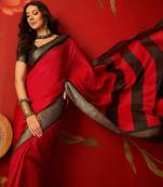 Red silk cotton zari saree with unstitched blouse piece.