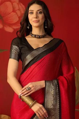 Red silk cotton zari saree with unstitched blouse piece.