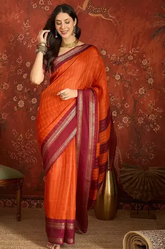 Orange silk cotton zari checks saree with unstitched blouse piece.