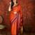 Orange silk cotton zari checks saree with unstitched blouse piece.